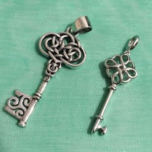 PAIR OF STERLING SILVER KEYS. Get a third small one for free.